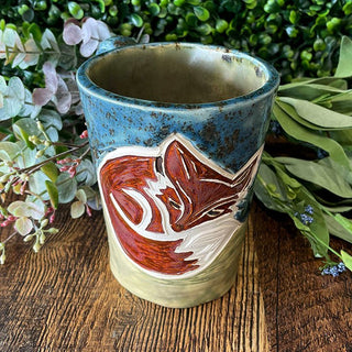 Ceramic mug with a sleepy fox